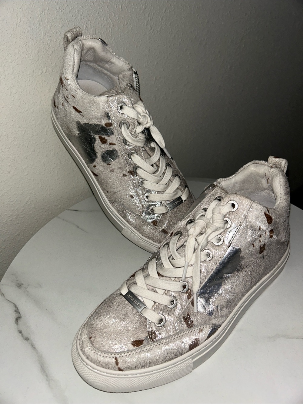 J Slides NYC cow print sneakers